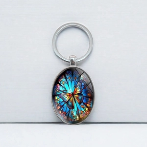 Bunter Schmetterling Glas-Cabochon Ovaler Schlüsselanhänger mit Metallring-Anhänger