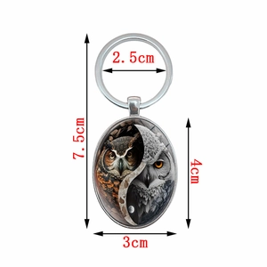 Creative owl yin yang pendant metal keychain with oval glass cabochon design