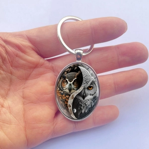 Men's metal oval keychain with owl yin yang pattern and protective glass dome
