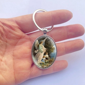 Guardian Angel oval pendant keychain with vintage religious illustration in silver metal frame