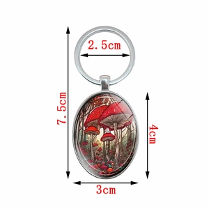 Elegant red mushroom oval pendant keychain with polished silver metal ring and glass dome