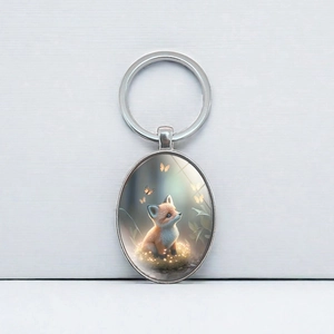 Oval silver metal keychain with a cute fox and butterfly illustration pendant