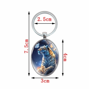 Porte-clés avec pendentif en verre motif tigre et design de ciel étoilé d'art