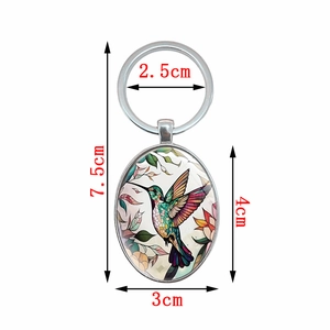 Creative oval hummingbird pendant keychain with dimensions of 7.5cm total length