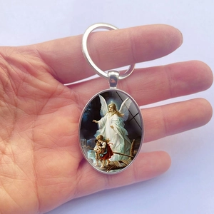 Oval silver metal keychain featuring a guardian angel painting and a secure keyring
