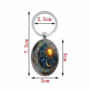 Oval sun and moon pendant keychain with blue and gold art, 7.5cm silver metal ring