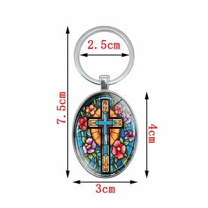 Oval cross keychain with colorful floral stained glass pattern and dimensions