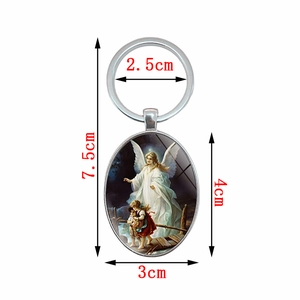 Guardian angel oval pendant keychain with silver metal ring and size measurements