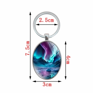 Oval aurora landscape pendant keychain with silver metal frame and dimensions marked