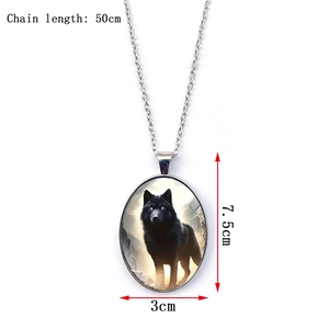 Detail view of oval wolf pendant necklace showing 50cm chain length and pendant size