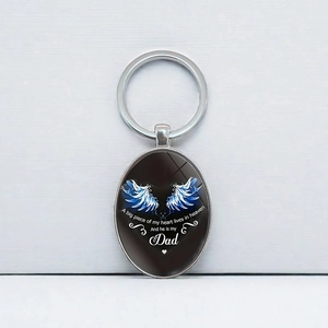 Silver oval angel wing keychain with memorial Dad quote on a metallic background