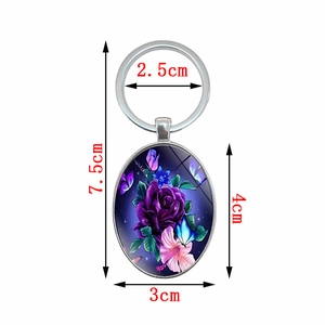 Elegant oval keychain featuring purple roses and butterfly design with dimensions 7.5cm