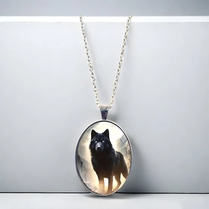 Oval lone wolf totem pendant necklace with detailed black wolf portrait and silver chain
