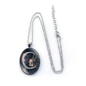 Oval silver pendant necklace featuring Moon Goddess and fairy art on a slim chain