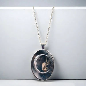 Silver crescent moon goddess oval pendant necklace with blue night sky fairy design