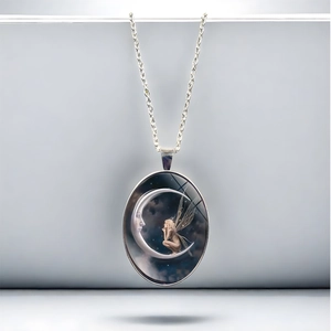 Goddess of the moon oval pendant necklace with silver chain and fantasy fairy design