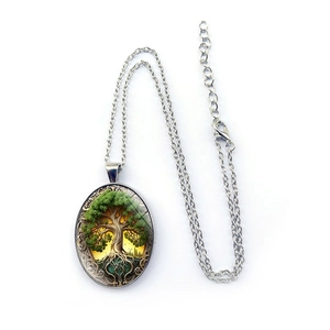 Vintage Tree of Life oval pendant necklace in antique silver with green foliage design