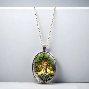 Oval Tree of Life pendant necklace with silver Celtic hollow carving on white background