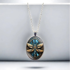 Vintage dragonfly pendant necklace with stained glass style and silver chain in macro view