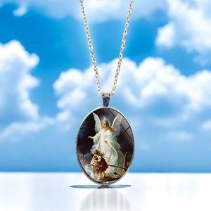 Close-up of an oval angel pendant necklace featuring a classic guardian angel painting