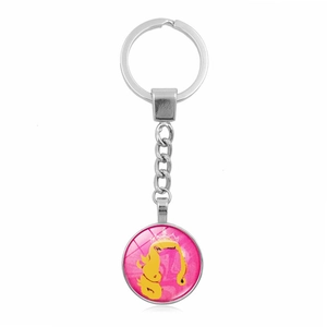 Porte-clés en métal argenté poli avec pendentif rond rose et jaune à personnage