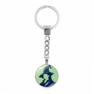 Porte-clés Wicked Glinda Elphaba avec silhouette de sorcière et pendentif en verre vert