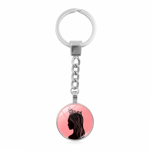 Porte-clés métal avec pendentif rose Glinda Elphaba et silhouette de couronne chic