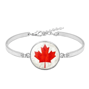 Detail of silver Canada flag bracelet showing the maple leaf emblem and lobster clasp chain