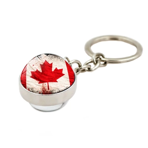 Polished silver keychain with a Canadian flag maple leaf glass cabochon pendant