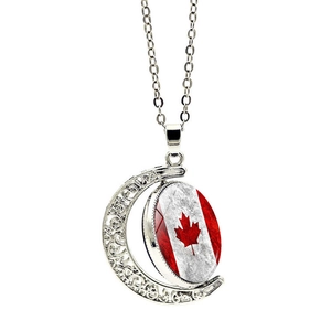 Detail view of rotating moon pendant featuring a vintage Canadian flag in silver alloy