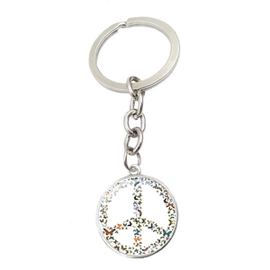 Detailed view of silver peace sign keychain pendant with colorful butterfly pattern design