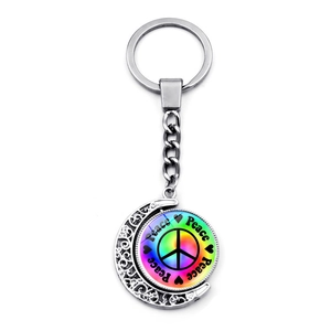 Silver alloy moon keychain with rotating rainbow peace sign pendant for car and bags