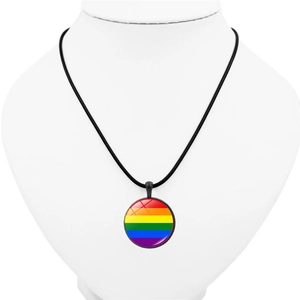 Detail of round rainbow heart pendant on black leather cord displayed on white neck bust