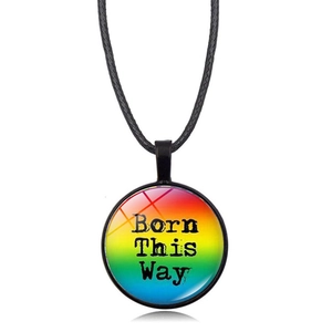 Macro shot of Born This Way rainbow round pendant on a black braided cord necklace