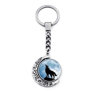 Rotating wolf howling at the moon metal keychain with silver crescent moon pendant