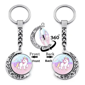 Rotating crescent moon keychain with cute unicorn graphic and 360-degree spinning feature