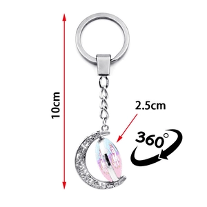 Detail of 10cm unicorn keyring with a 360-degree rotating 2.5cm moon pendant charm