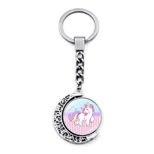 Cartoon unicorn keychain with rotating moon charm and silver metal alloy ring