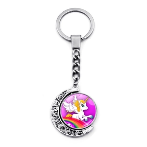 Detailed macro view of the rotating silver unicorn moon pendant keychain for women