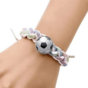 Detail of hand-woven macaron soccer bracelet with silver football glass cabochon charm