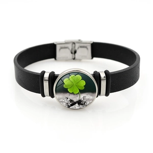 Minimalist black leather clover bracelet with green shamrock glass dome and metal buckle