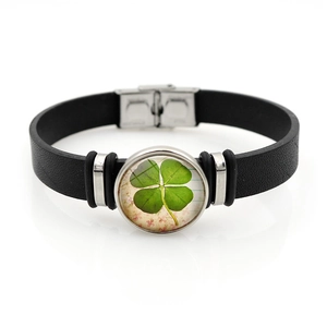 Lucky four-leaf clover black leather bracelet with stainless steel clasp on white background