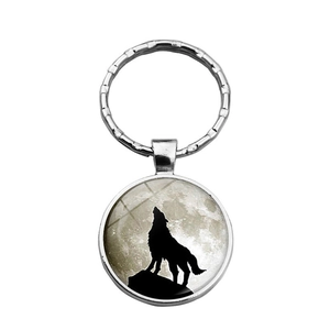 Porte-clés cabochon en verre avec loup hurlant à la pleine lune et monture argentée
