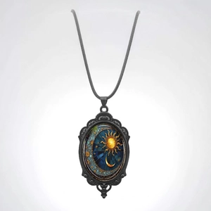 Vintage oval pendant necklace featuring sun moon stars design with black metal frame