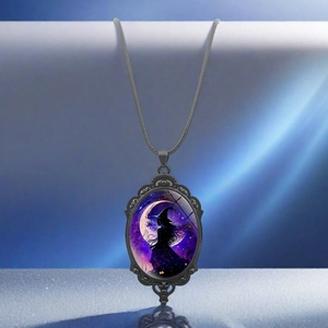 Detail of gothic witch oval pendant with crescent moon and stars on a black cord