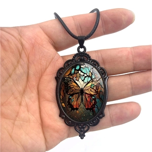 Vintage oval butterfly pendant necklace with elegant carved frame and black wax cord necklace