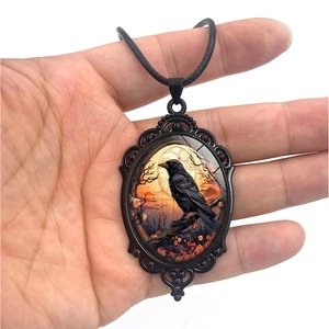 Vintage Gothic raven pendant necklace with ornate floral pattern and sunset illustration