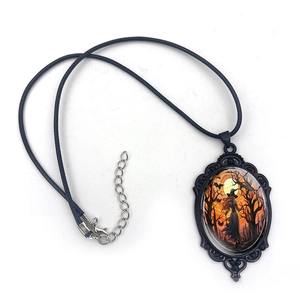 Gothic vampire bat necklace with witch and pumpkin pendant on a black cord