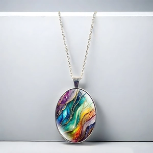 Detailed close-up of oval nebula-style resin pendant with colorful swirl patterns
