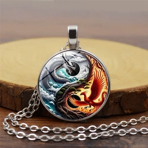 Yin Yang Tai Chi dragon and phoenix pendant necklace with silver O-chain on wood base